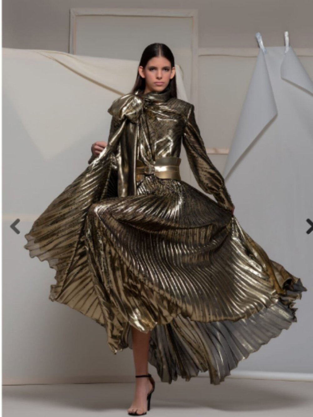 Womans gold designer evening gown